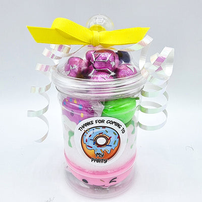 Sweet Box party goody bags in cellophane bags or vintage plastic jars with candy cupcake sweets themed toys, chocolate, and candy for children.