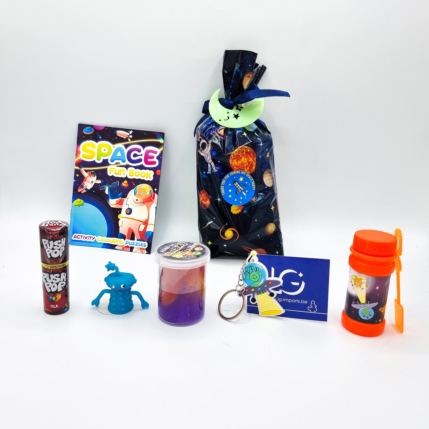 Pre Filled Space Rocket Birthday Party Goody Bags For Children With Alien Toys And Sweets.