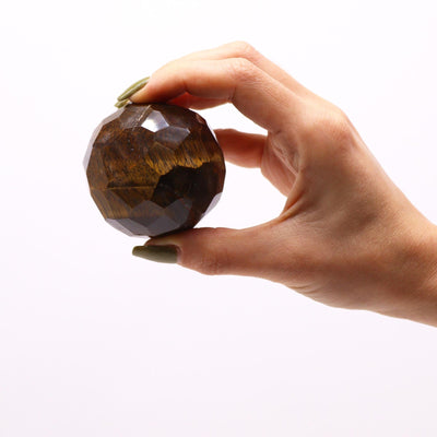 Tiger Eye Gemstone Faceted Ball Ornament With Wooden Stand.