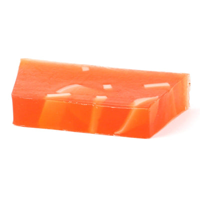 Hand made orange zest soap loaf and slices made with essential oil, with a sweet, zesty fragrance and is made with soap ribbons.