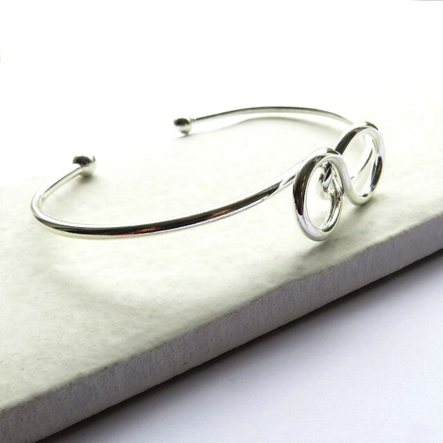 Women's Silver Plated Infinity Bangle In Gift Box.