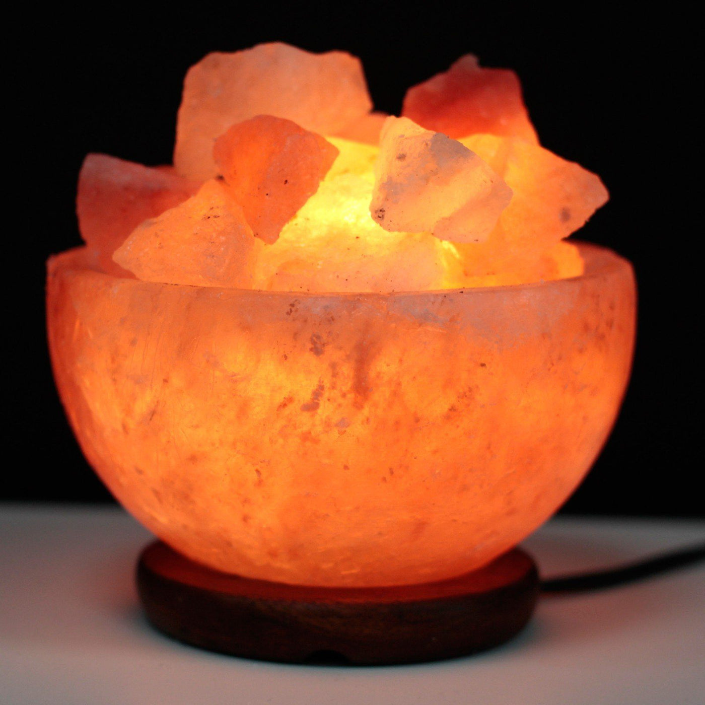 Himalayan Salt Fire Bowl and Chunks Lamp On A Dark Wooden Base